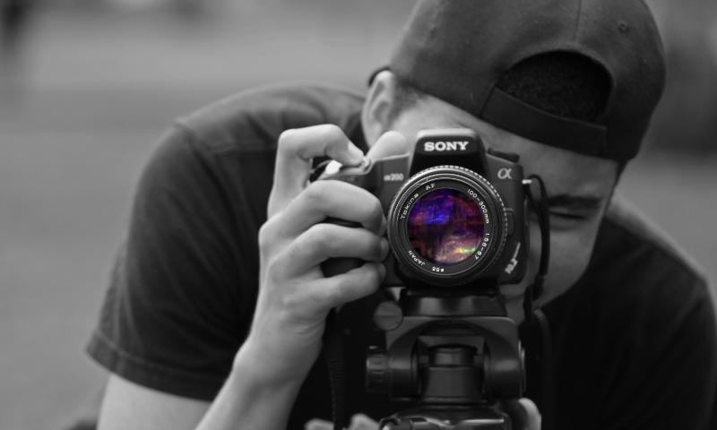Photo of a student using a camera