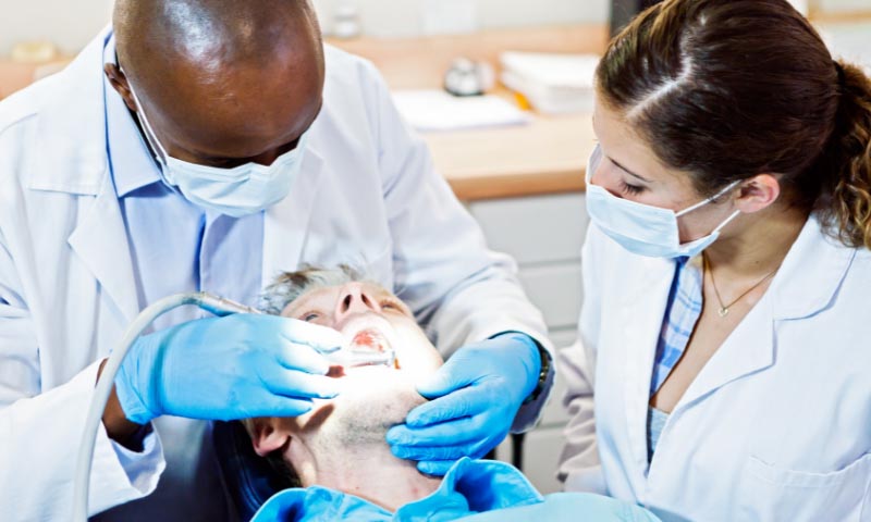 A dentist performing a checkup